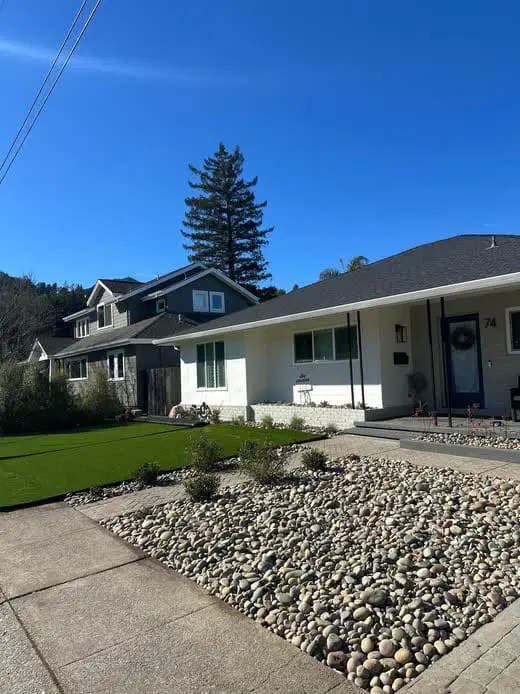Modern front yard landscape design featuring turf, decorative rock beds, and native plants in Napa, CA.