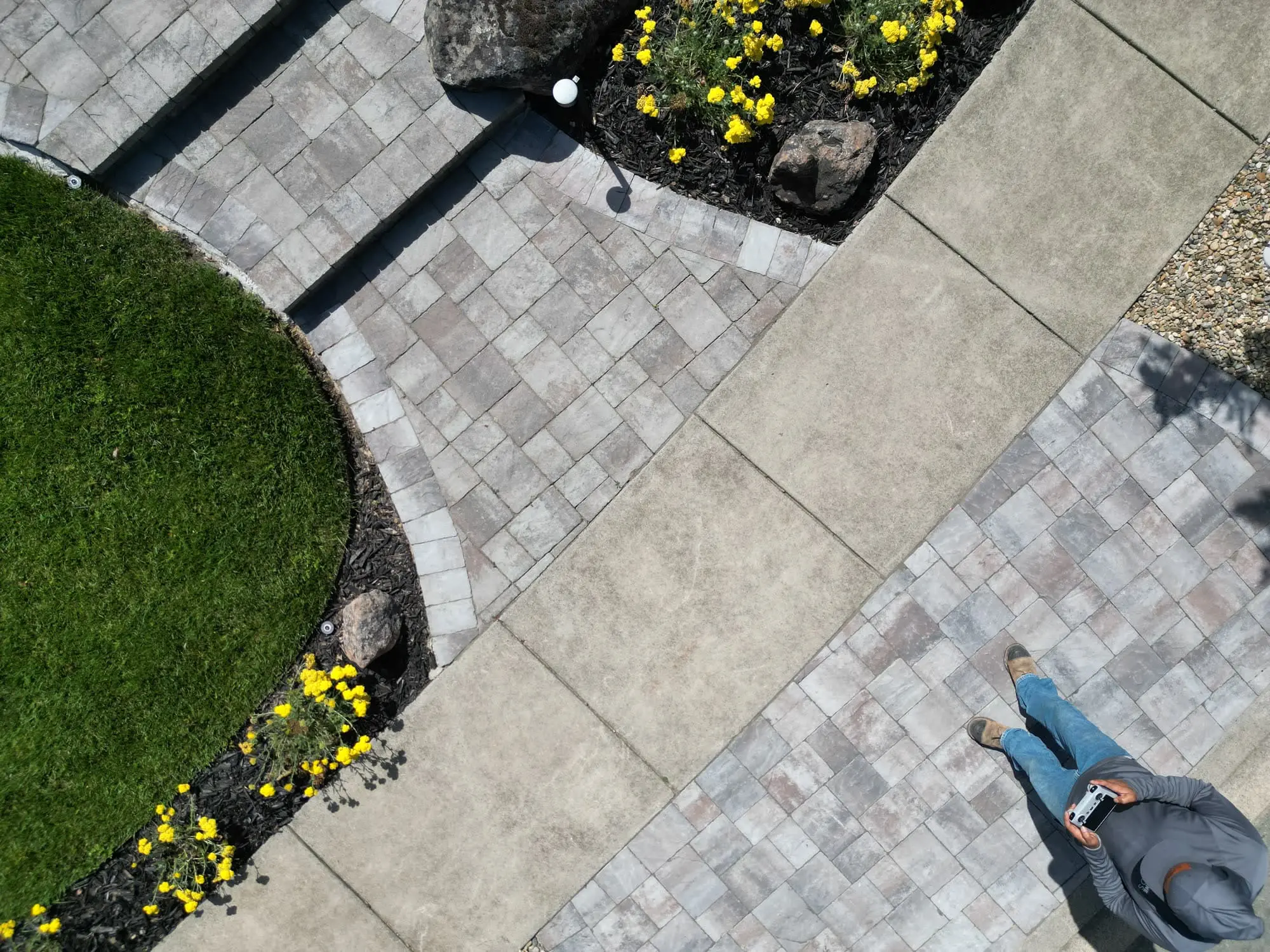 Overhead view of professional landscape designer services in Napa, CA featuring custom paver walkways, turf, and garden beds.
