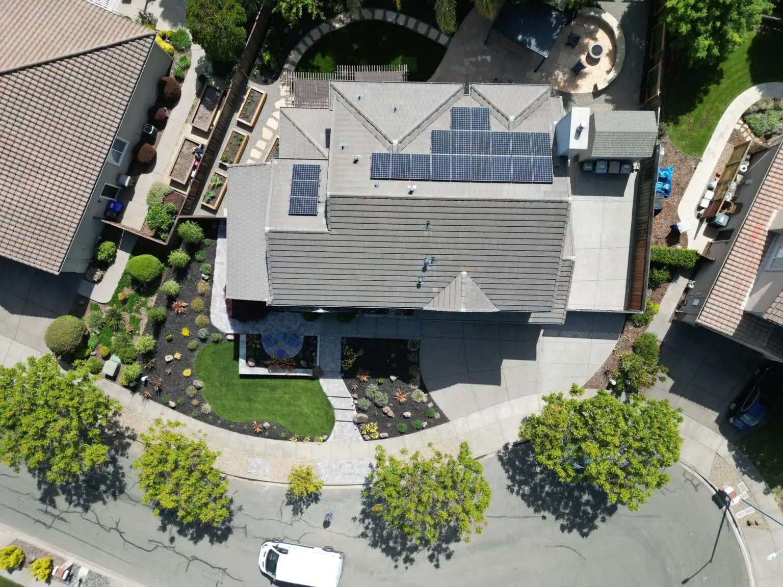 Overhead aerial view of professional landscape designer services in Napa, CA featuring custom paver walkways, turf, and garden beds.